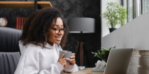 Woman using laptop at home office